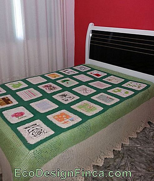 Patchwork quilt with green crochet