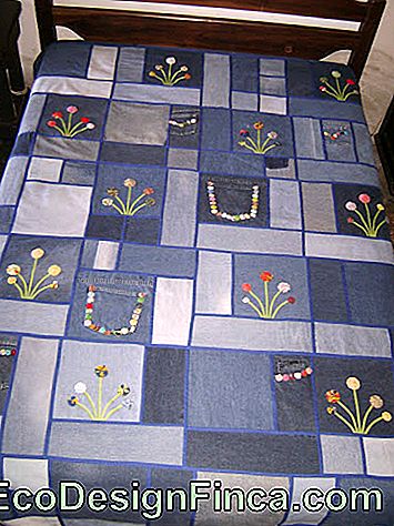 Jeans patchwork quilt with embroidery